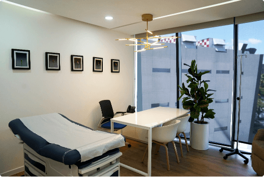 Picture of clinic with bed and desk