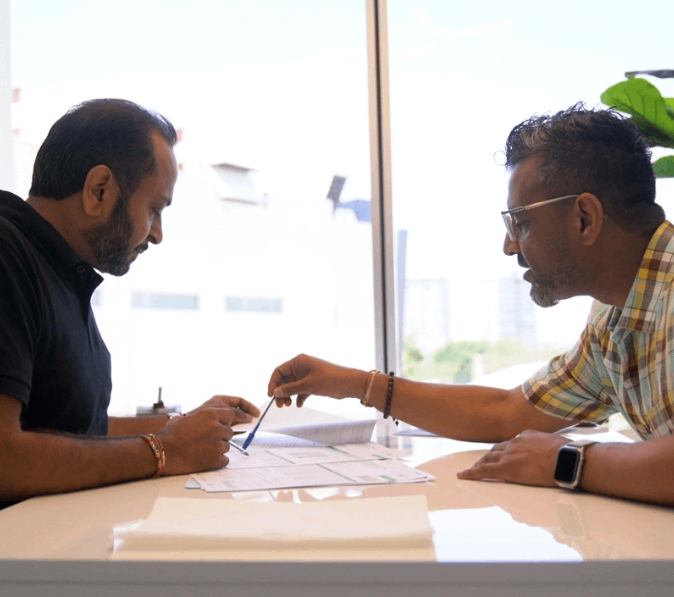 Two men in a meeting room