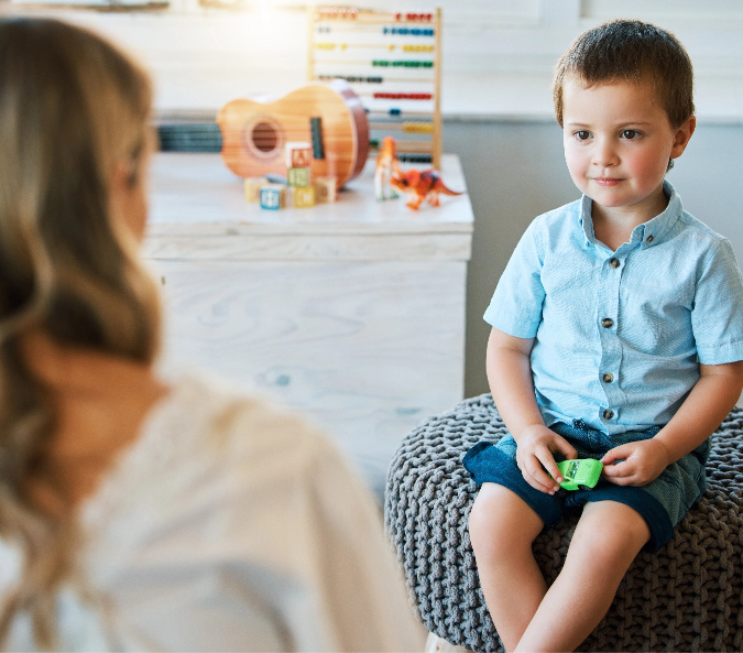 Boy talking to adult